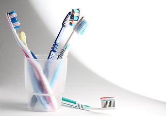 Image showing Toothbrushes in a glass