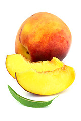 Image showing Ripe peach with slices