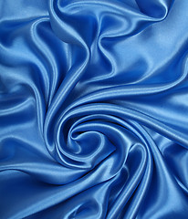 Image showing Smooth elegant blue silk as background 