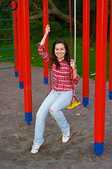 Image showing happy young woman on playground