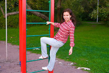 Image showing happy young woman on playground
