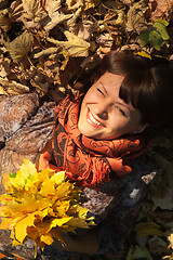 Image showing woman with autumn leaves