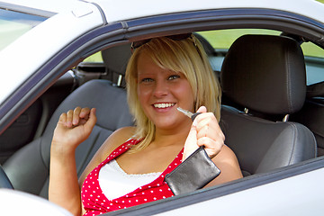 Image showing Young woman happy about her new drivers license