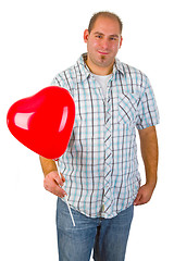 Image showing Young man with red heart ballon