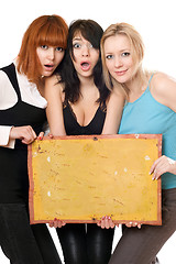 Image showing Surprised women taking a board