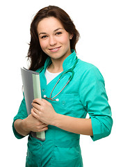 Image showing Young attractive woman wearing a doctor uniform