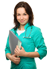 Image showing Young attractive woman wearing a doctor uniform