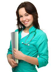 Image showing Young attractive woman wearing a doctor uniform