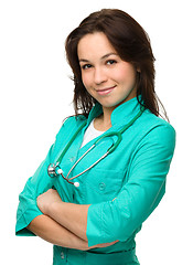 Image showing Young attractive woman wearing a doctor uniform