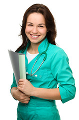 Image showing Young attractive woman wearing a doctor uniform