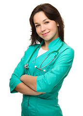 Image showing Young attractive woman wearing a doctor uniform