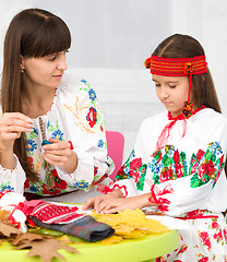 Image showing Mother and child in Ukrainian national cloth