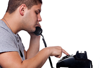 Image showing Man Dialing Old Rotary Telephone