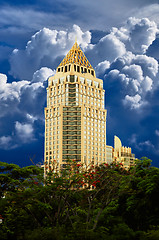 Image showing Golden skyscraper on blue sky background
