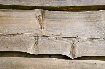 Image showing Wooden village house wall carved planks background 