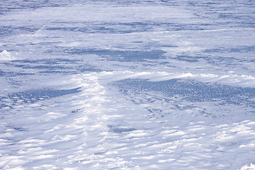 Image showing Snow hummocks on frozen reservoir