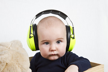 Image showing baby with ear protection