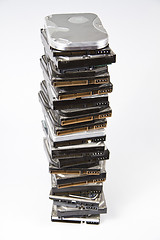 Image showing Stack of hard drive with opened one on top