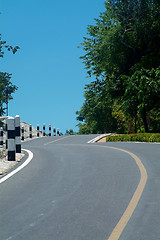 Image showing Winding road over a hill