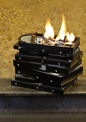 Image showing burning stack of hard drives