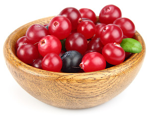 Image showing Fresh berries in a wooden plate