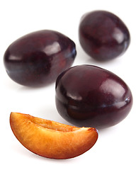 Image showing Sweet plums with slice