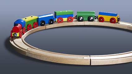 Image showing colorful wooden toy train on tracks