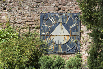 Image showing old sundial on a brick wall