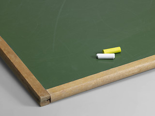 Image showing black board and crayons