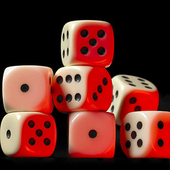 Image showing pile of red illuminated white dice