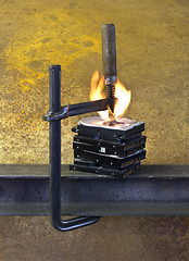 Image showing burning vise and hard disks