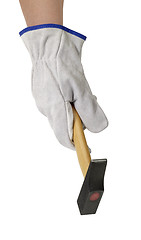Image showing gloved hand with hammer