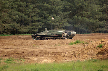 Image showing offroad scenery with driving tank