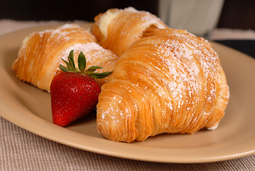 Image showing Three sfogliatelle's with strawberry