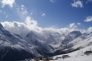 Image showing Cafe and hotels in high mountains. Ski resort.