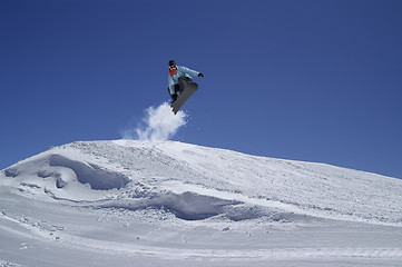 Image showing Snowboarder jumping in terrain park