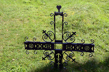 Image showing Metal decorative cross in meadow partisan cemetery 