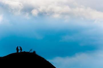 Image showing A couple reached the peak of the mountain