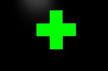 Image showing Green cross on black background with a little light