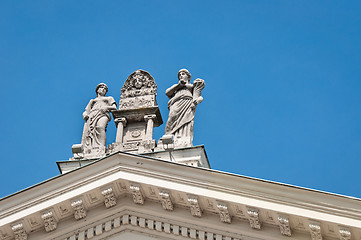 Image showing Roman statues on a roof against blue sky