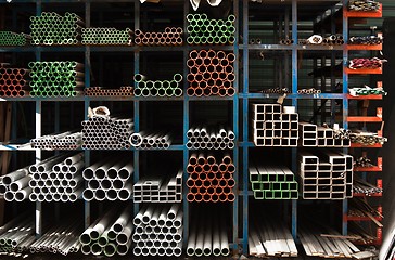 Image showing Pipes stacked up in a factory 