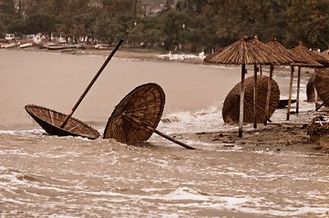 Image showing A dirty polluted beach  in the rain