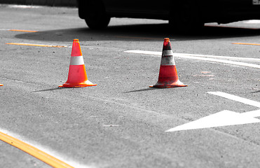 Image showing Road block with white arrow showing the alternate way