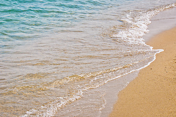 Image showing Coastal line with water and sand at the ocean