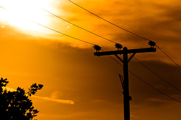 Image showing High voltage post against sky at dusk
