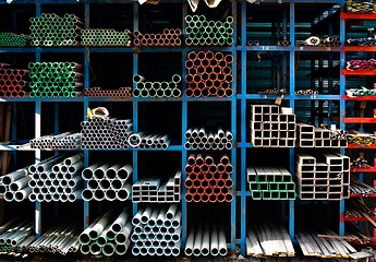 Image showing Pipes stacked up in a factory 