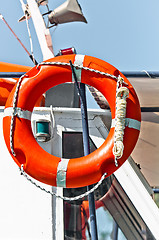 Image showing Red bouy on a boat ready to save lives