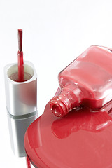 Image showing Nail Polish Spilling on a Mirror with the Brush Standing