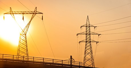 Image showing High voltage post against sky at dusk