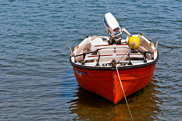 Image showing Small boat on blue water 
